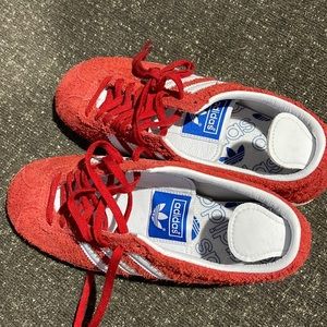 Adidas red sneakers.  Never worn.